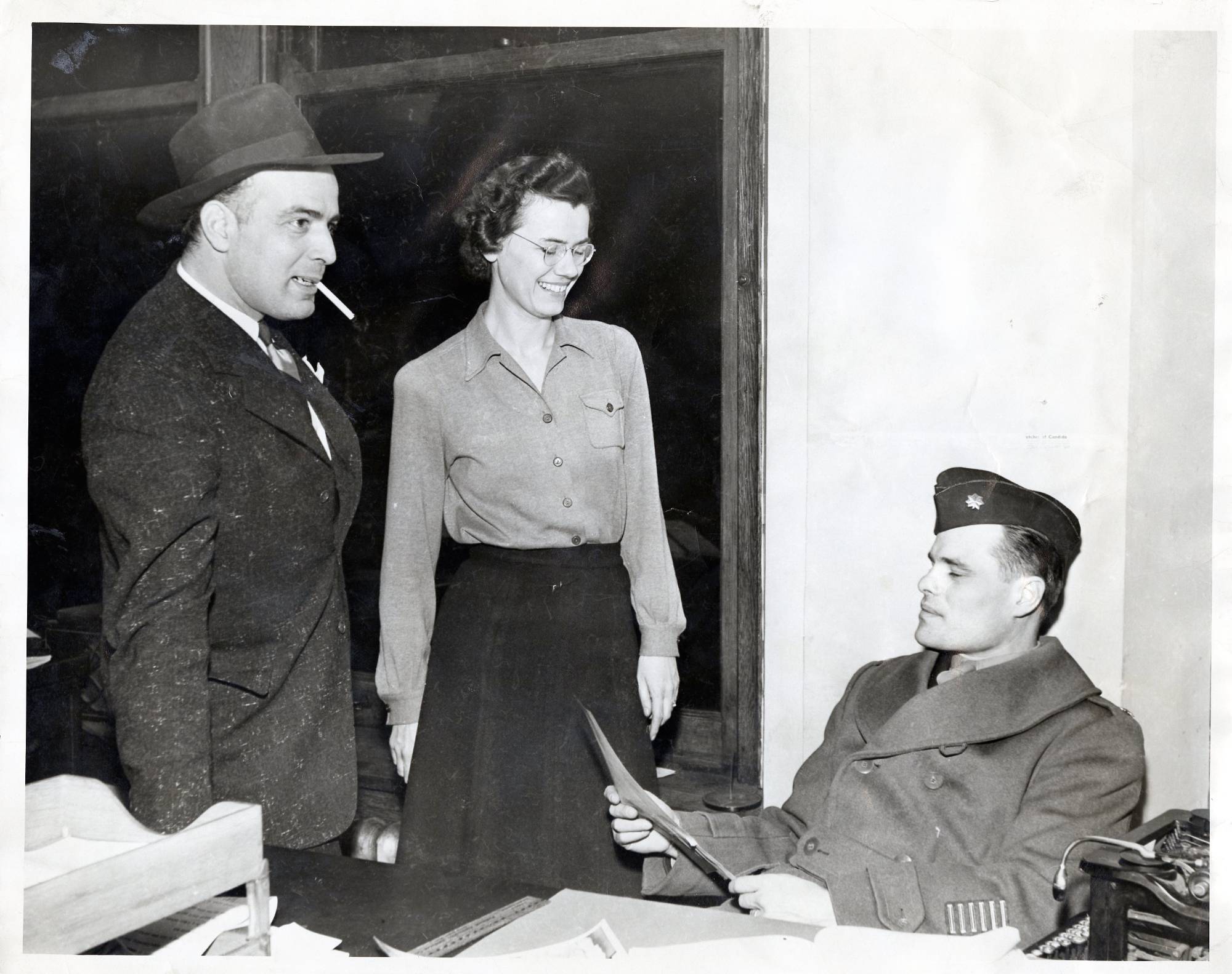 Ralph Hauenstein working with a female and a male military personal